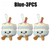 Three blue bread plush keychains with striped straws and smiling faces