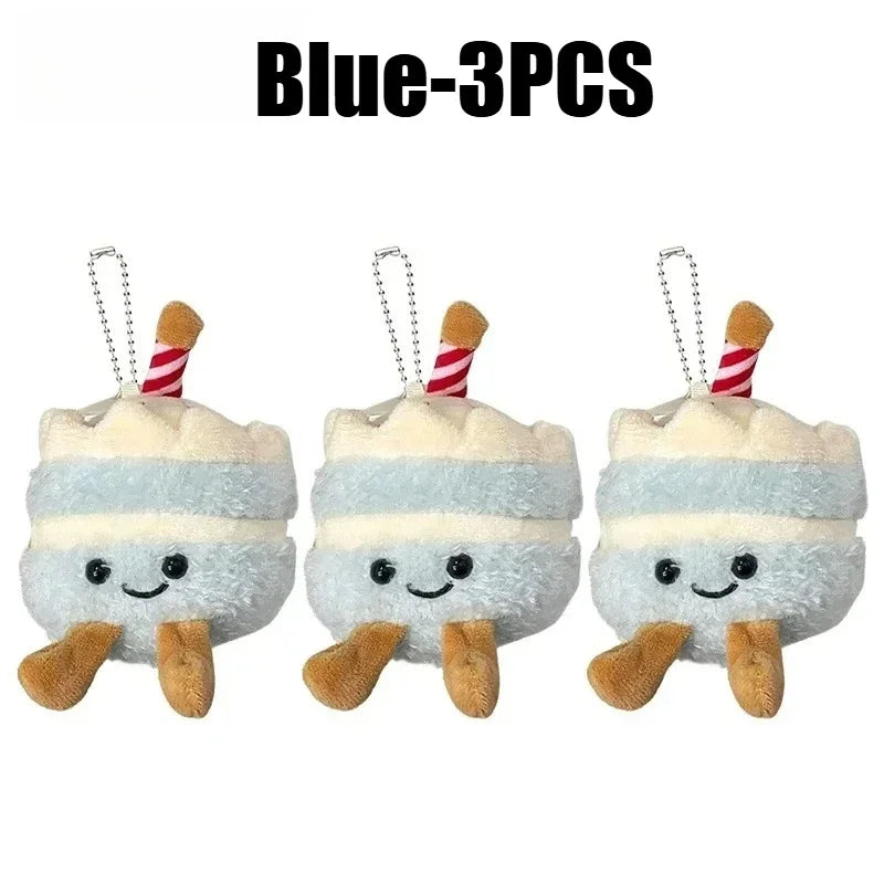 Three blue bread plush keychains with striped straws and smiling faces