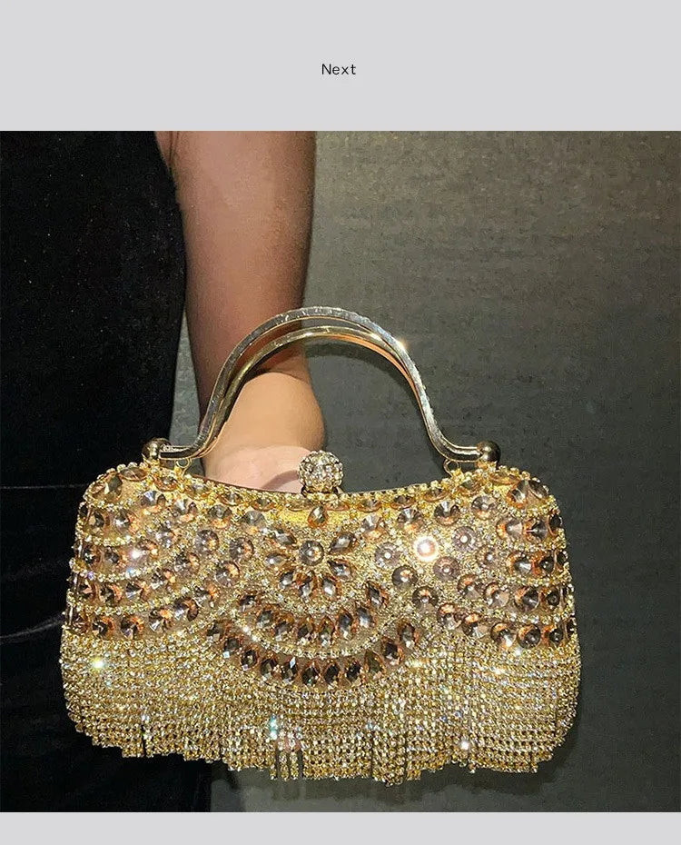 A golden diamond rhinestone evening clutch bag with a tassel being held by a person's hand.