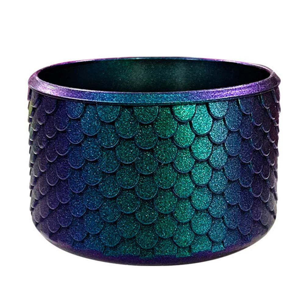 A dark purple and teal silicone boot sleeve designed to fit water bottles.