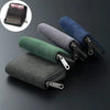 A collection of compact RFID-blocking card wallets in various colors including black, gray, dark blue, and green.
