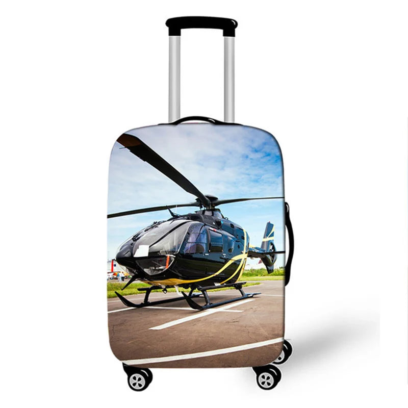 A silver rolling suitcase with a protective black cover featuring a helicopter.