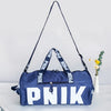 A navy blue Nike shoulder bag with white lettering is displayed on a white surface.