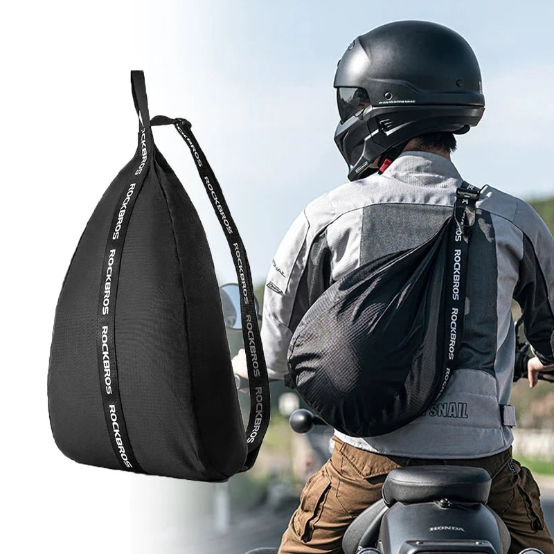 A person wearing a black helmet is shown with a black multifunctional backpack for cycling and travel.