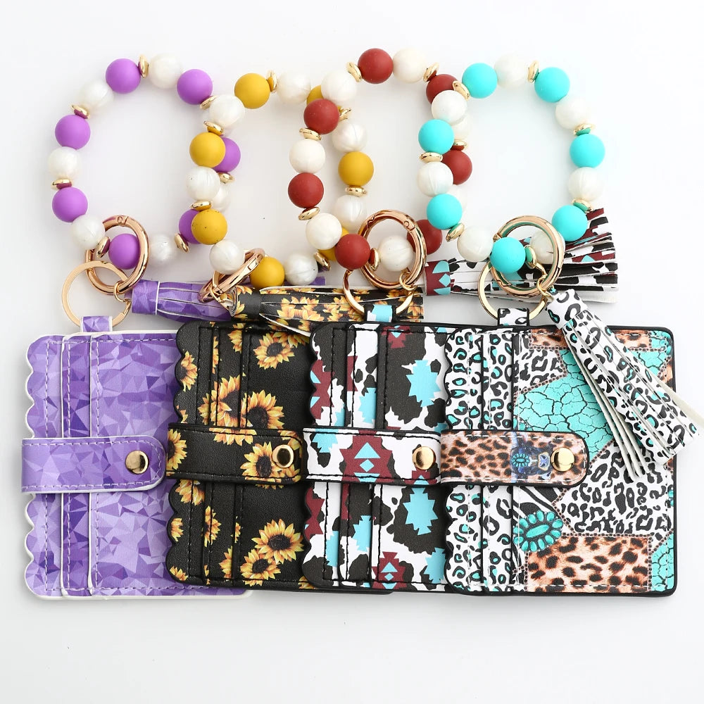 A silicone bead and leather card wallet featuring colorful beads and patterned leather sections.