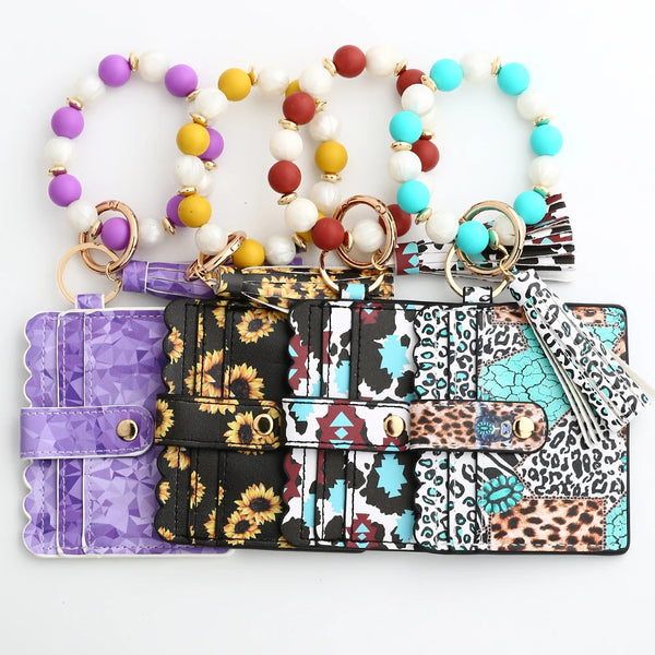A silicone bead and leather card wallet featuring colorful beads and patterned leather sections.