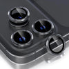 A close-up view of a glitter diamond camera lens protector with a metal frame for an iPhone, showing four lenses.