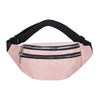 A light pink nylon crossbody sling bag with a black adjustable strap and zipper.
