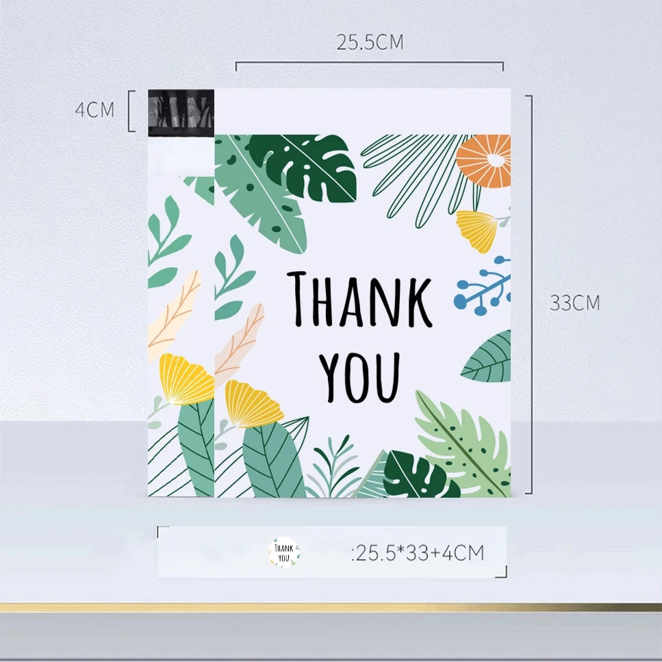 Carte verticale avec motif de feuille tropicale verte et orange, avec le texte MERCI