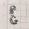 Silver stainless steel alphabet letter charm shaped like the letter G with a lobster clasp, measured against a ruler.