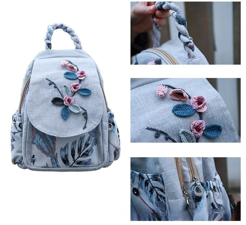 A light gray linen backpack featuring delicate floral embroidery details.