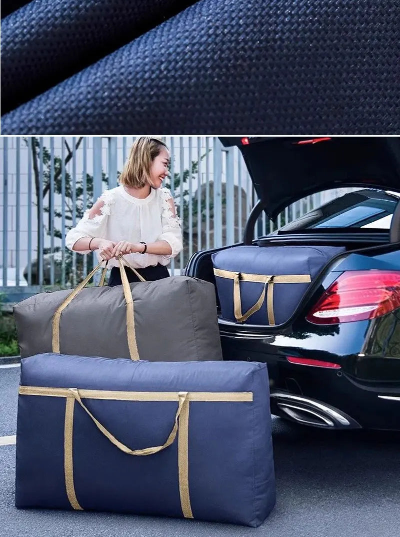A woman stands next to a black car with open trunk, holding two navy blue storage bags.