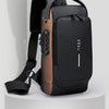 A black anti-theft crossbody chest bag with a brown leather accent and adjustable strap shown against a light gray background