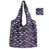 A navy blue tote bag with a floral print featuring small red and white fish patterns.