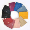 Collection de porte-cartes en cuir véritable gravé sur mesure dans diverses couleurs : violet, bleu, noir, orange et beige