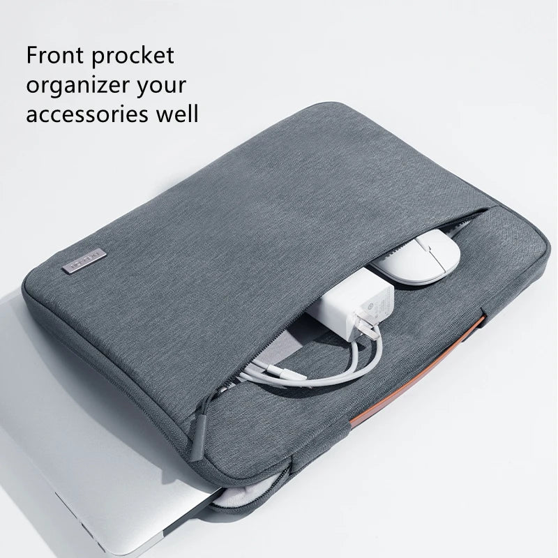 A gray multi-pocket laptop sleeve organizer with a front pocket and handle, shown next to a silver laptop.