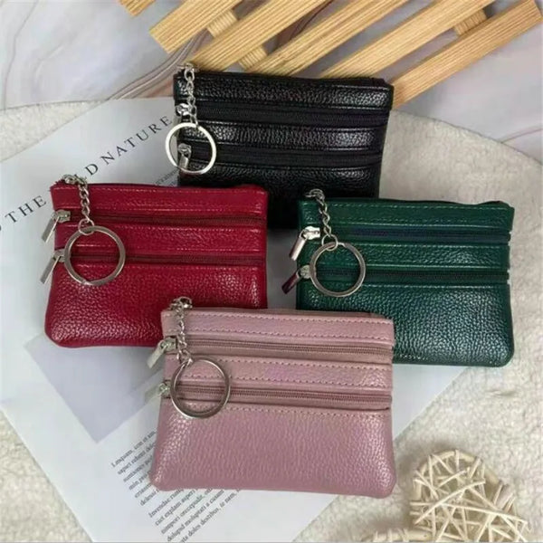 A collection of four foldable PU leather clutch wallets in shades of black, red, green, and pink, displayed on a white backgr