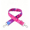 Pink and purple geometric patterned nylon crossbody bag strap with a silver metal buckle