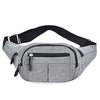 A gray canvas waist fanny bag with black trim and adjustable strap.