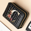 A black PU leather double-zip clutch wallet with a gold accent and a cartoon print design.