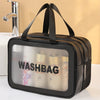A black double-layer clear and dry wash bag with black straps is shown on a white surface.