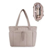A light beige quilted padded tote bag with a flap closure and multiple interior pockets.