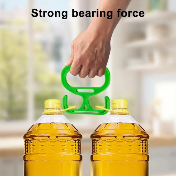 A hand is shown applying strong bearing force to a green ergonomic shopping bag carrier holding two glass bottles of oil.