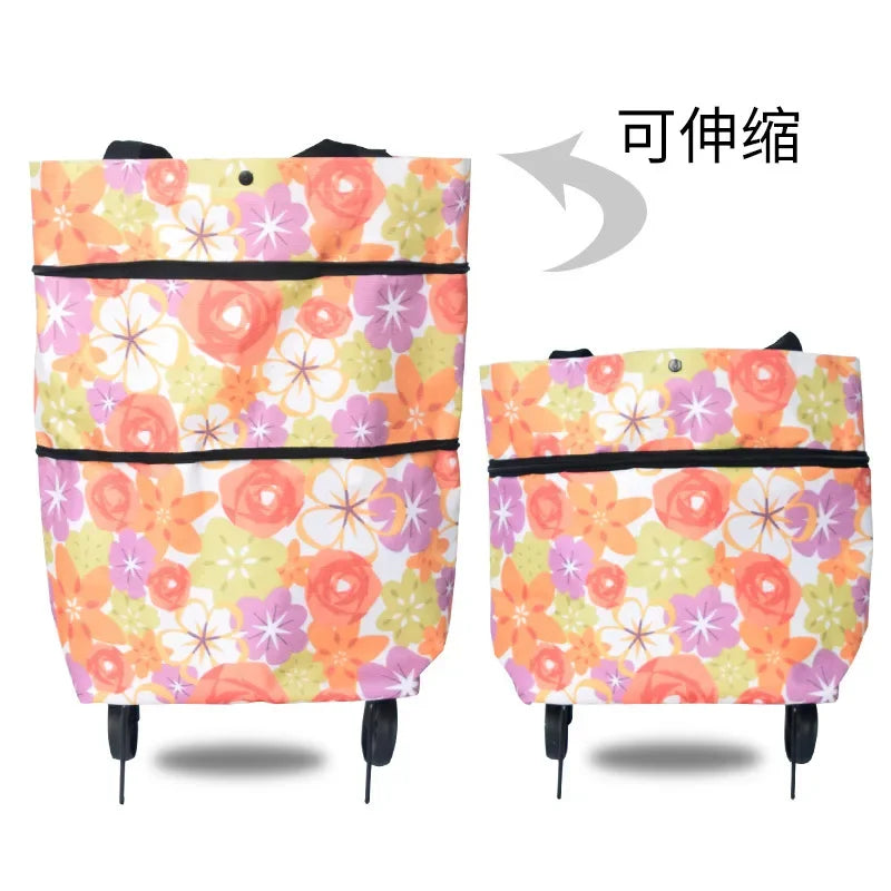 A floral patterned folding shopping trolley bag with black trim and handles.
