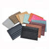 Sammlung von echten Kuhfell-ID-Card-Haltertaschen in verschiedenen Farbtönen wie Braun, Beige, Pink und Grün.