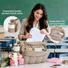 A woman is using an easy-access pocket in a beige insulated work tote, showing dedicated compartments for bottles and files.