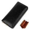 A black genuine leather zipper wallet shown from above with a gold-colored zipper detail.
