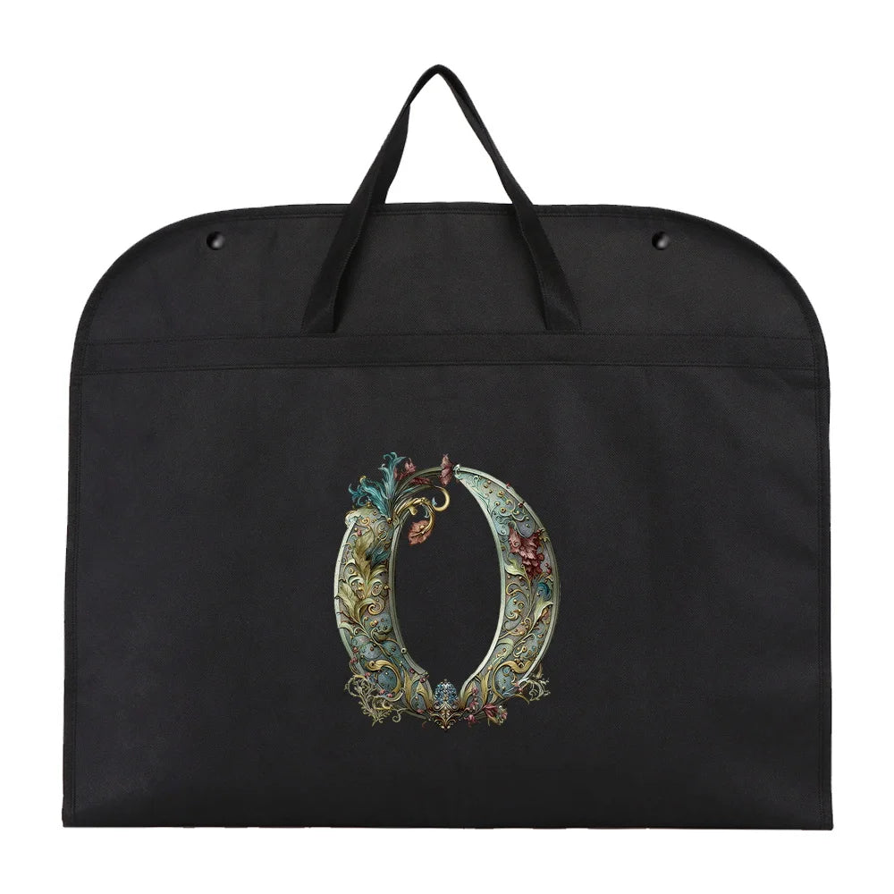 Black fabric dust cover and storage bag with an ornate gold and teal design.
