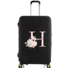 Black luggage with a pink floral monogram design and silver handle.