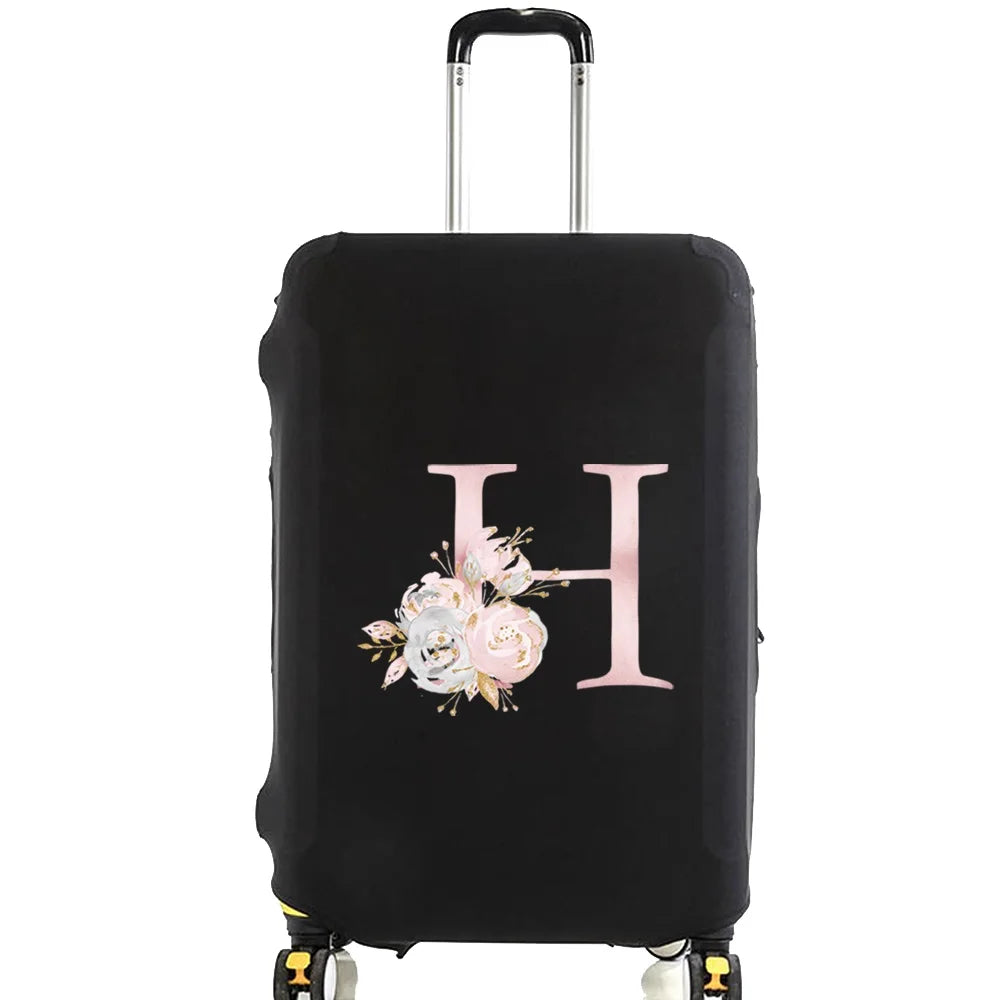 Black luggage with a pink floral monogram design and silver handle.