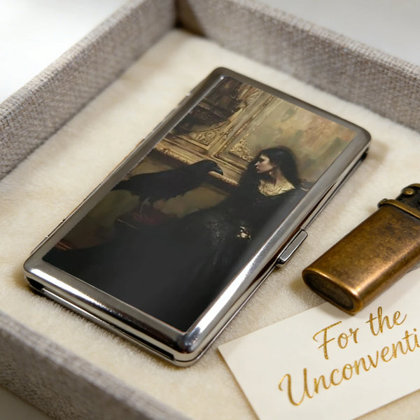 An Art Deco metal card holder with a dark photograph resting in a light-colored box.