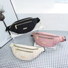 A pink multi-layer sports waist bag is displayed on a checkered surface next to a black one.