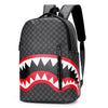 A black plaid laptop backpack featuring a red and white tooth pattern design.