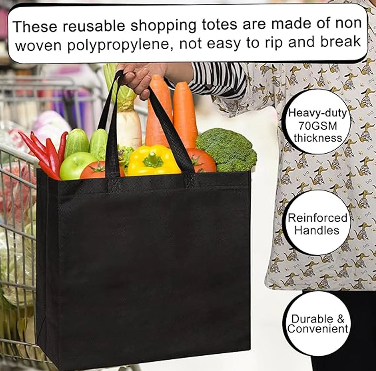 A black reusable grocery tote bag made of non-woven polypropylene being held by a person.