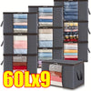 Nine dark gray foldable storage bags filled with folded clothing and bedding.