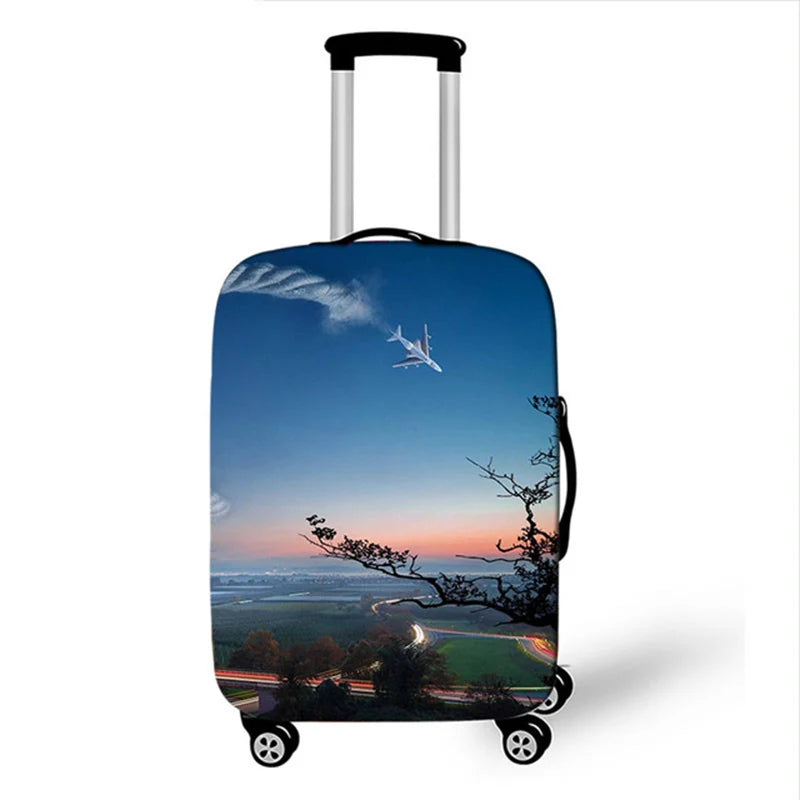 A dark blue suitcase with a scenic sunset sky and a white bird silhouette printed on it.