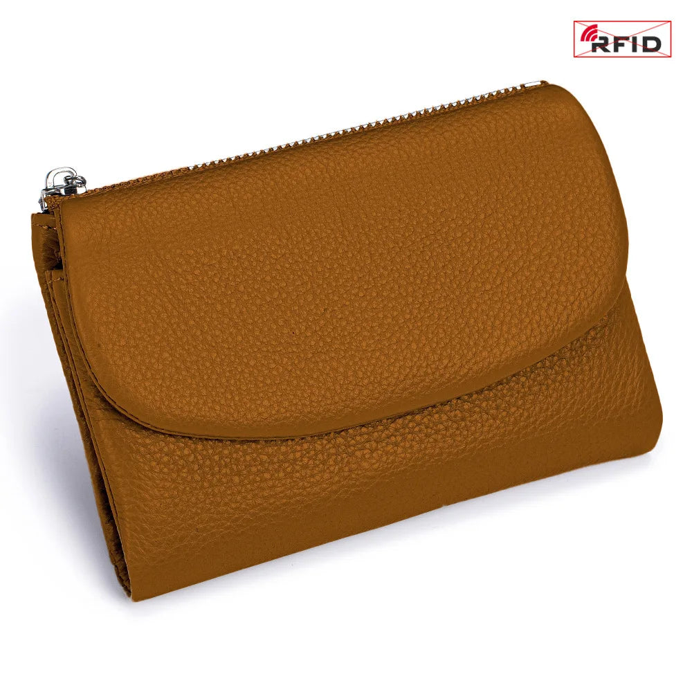 A brown genuine leather mini card holder wallet with a zipper closure and RFID protection logo.