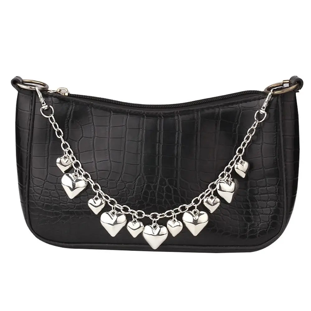 Black crocodile print purse with a silver chain strap