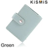 A light green slim leather card holder with a silver accent, shown at an angle.