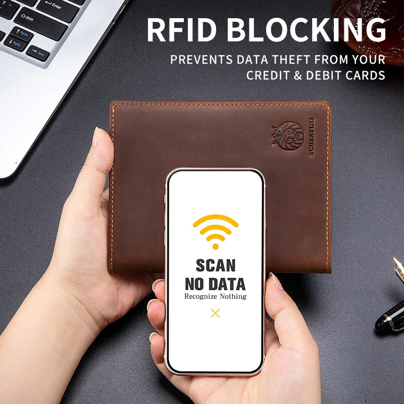 A hand holds a brown leather wallet with a smartphone displaying an RFID blocking screen.