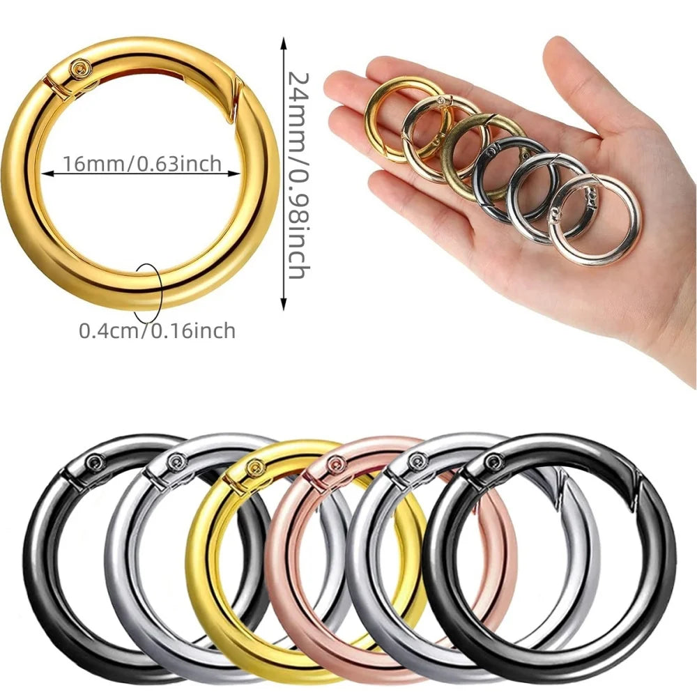 A collection of stainless steel spring clasp keychain rings in various colors and finishes.