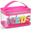 A clear pink toiletry bag with a zippered lid and a personalized letter accent spelling out MEDS