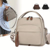 A beige multi-pocket shoulder crossbody bag shown with several variations and a woman wearing a light blue top.