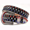 A decorative western buckle belt featuring black leather and rhinestones with red, blue, and silver accents.
