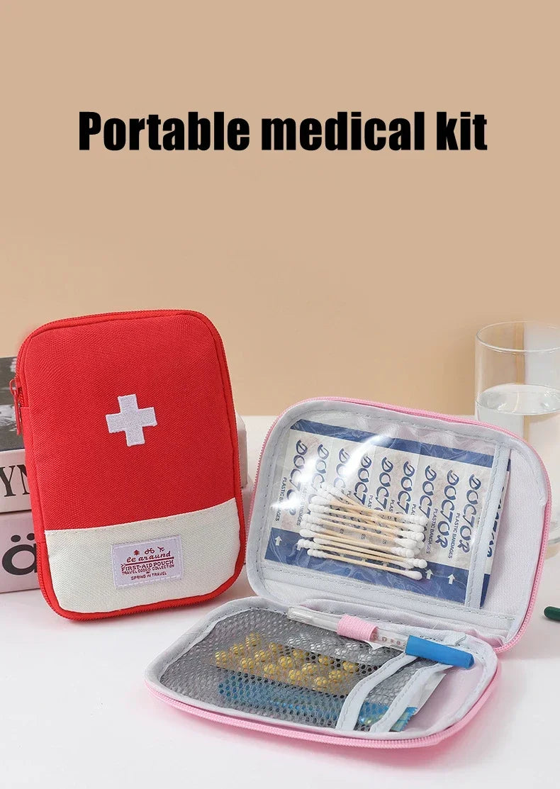 A red portable medical kit storage bag with an open compartment showing various medical supplies like bandages and pills.