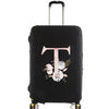 Black luggage with a pink floral monogram design on the side.